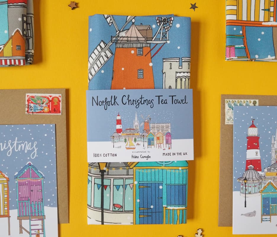 Photo showing some new products including tea towels and greetings cards