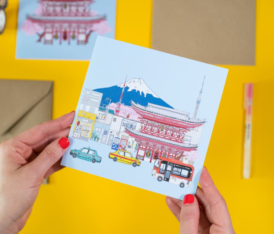 Photo of a Norwich greetings card in Helena's hands