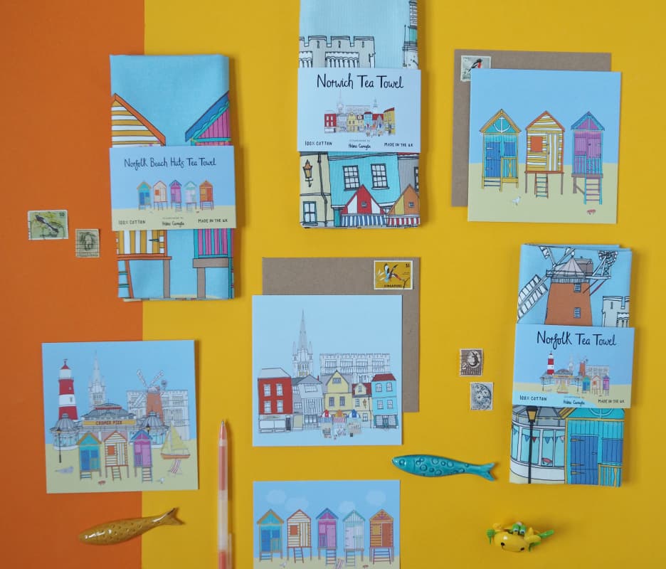 Photo of a collection of Norfolk themed products, including Tea Towels and Greetings Cards