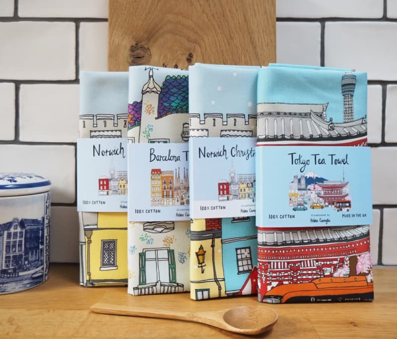 Photo of some tea towels lined up on a kitchen worktop